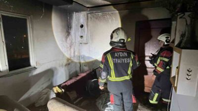 Efeler ilçesinde bulunan bir evde çıkan yangında bir çocuk ve