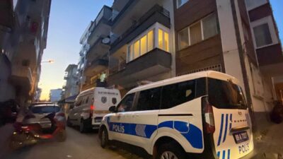 Efeler ilçesindeki bir apartmanda temizlik yapan bir kadın, cam silerken