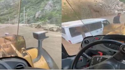 Hakkari ilinde bir derenin taşması sonucu yolda mahsur kalan minibüs,
