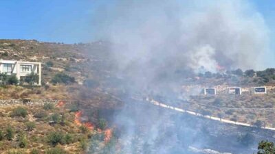 Muğla’nın Bodrum ilçesinde makilik alanda çıkan yangına ekipler müdahale ediyor.