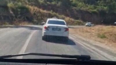 Muğla’nın Marmaris ilçesinde seyir halindeki bir araçtan çıkan yanmamış sigara