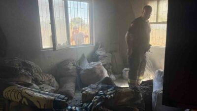 Serik ilçesinde bir gecekondu yangınında dumandan etkilenen yabancı uyruklu bir